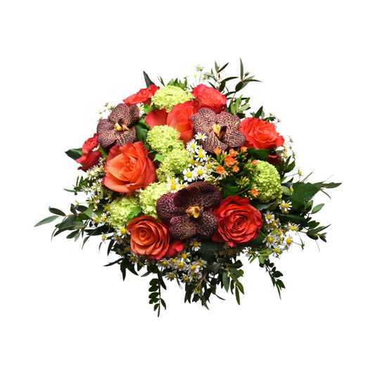 A vibrant hand tied bouquet featuring red vanda, roses, camomile, and viburnum, with a rich display of colors and foliage.