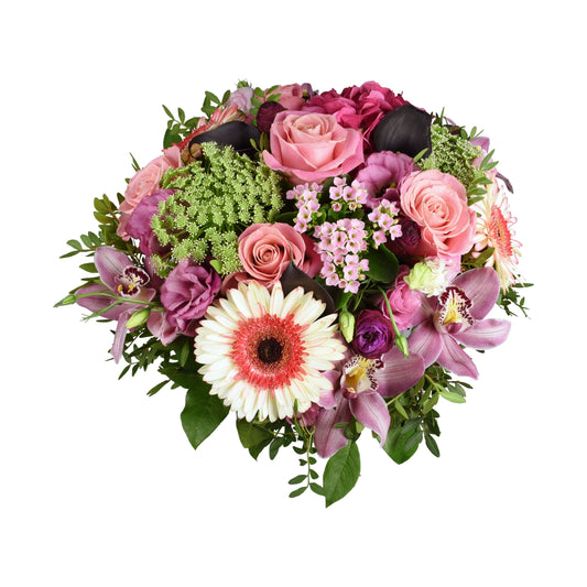 A hand-tied bouquet featuring large headed roses, eustoma, cymbidium orchid, gerbera, ammi, and bouvardia with pistachio and salal tips.