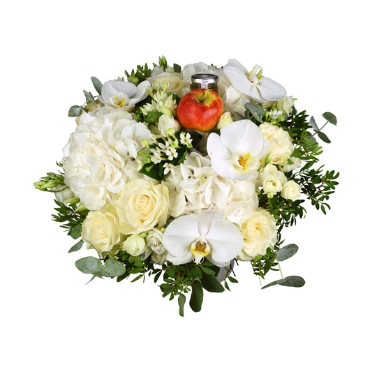 A hand-tied bouquet consisting of white hydrangea, white roses, white bouvardia, and white eustoma with greenery.