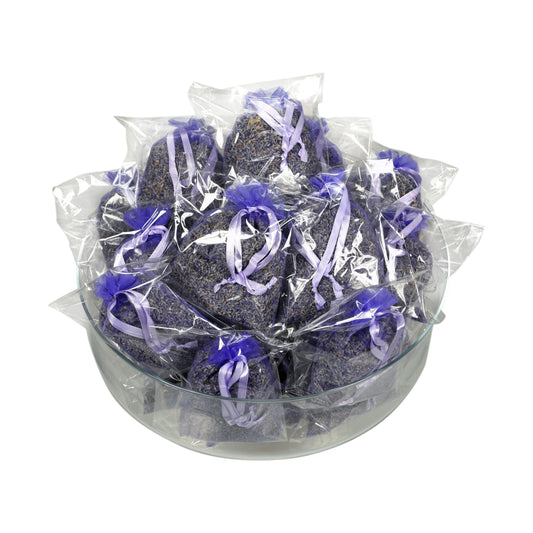A glass bowl filled with individual sachets of freeze-dried lavender.