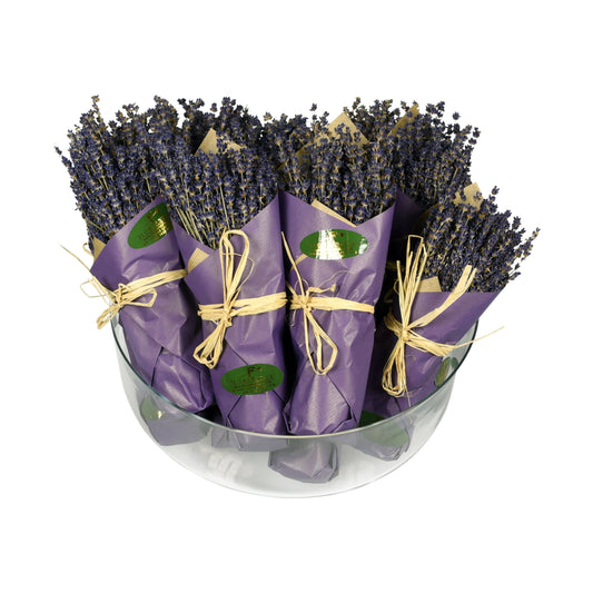 A luxury freeze-dried lavender bunch, with lavender flowers wrapped in purple paper and tied with a string, displayed in a clear container.